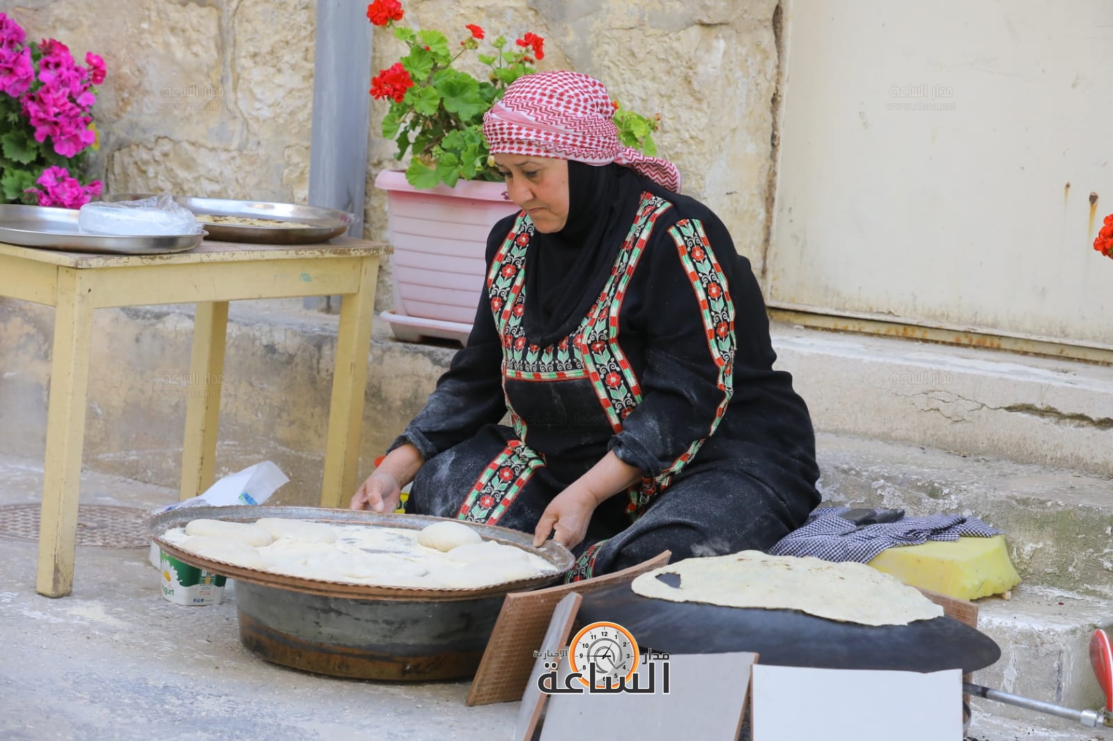 Madar Al-Saa Images 0.5592335796960188