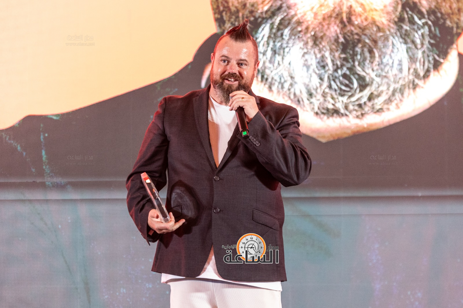 Madar Al-Saa Images 0.1358670228869998