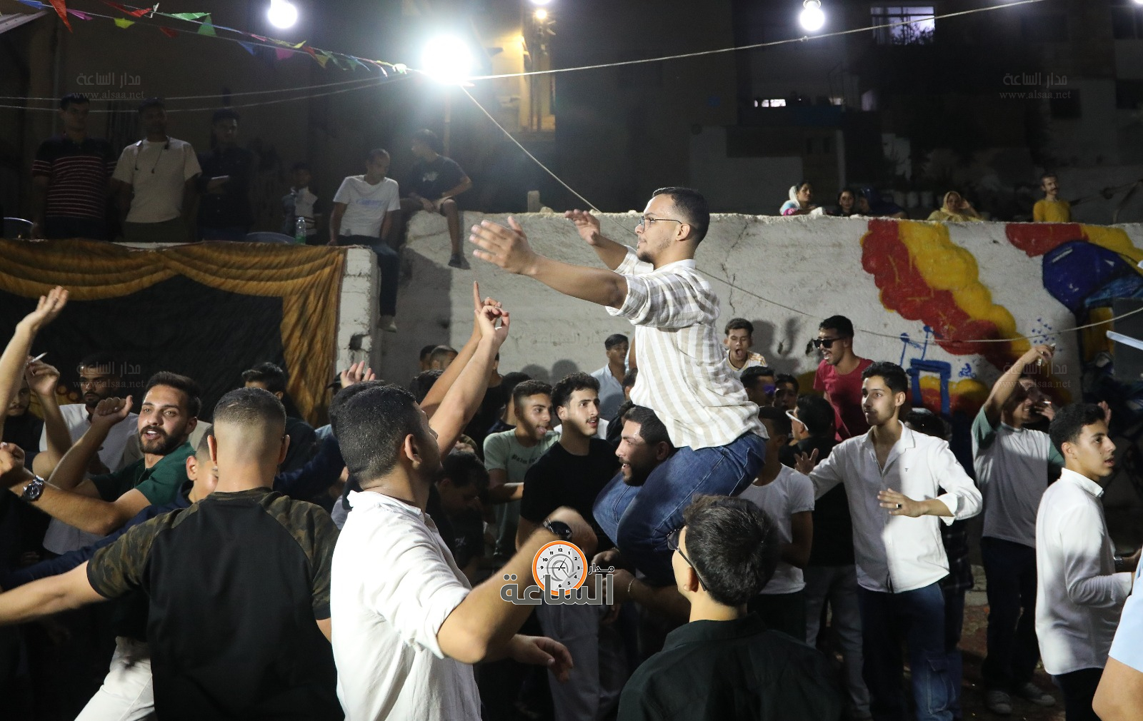 Madar Al-Saa Images 0.4950368160973