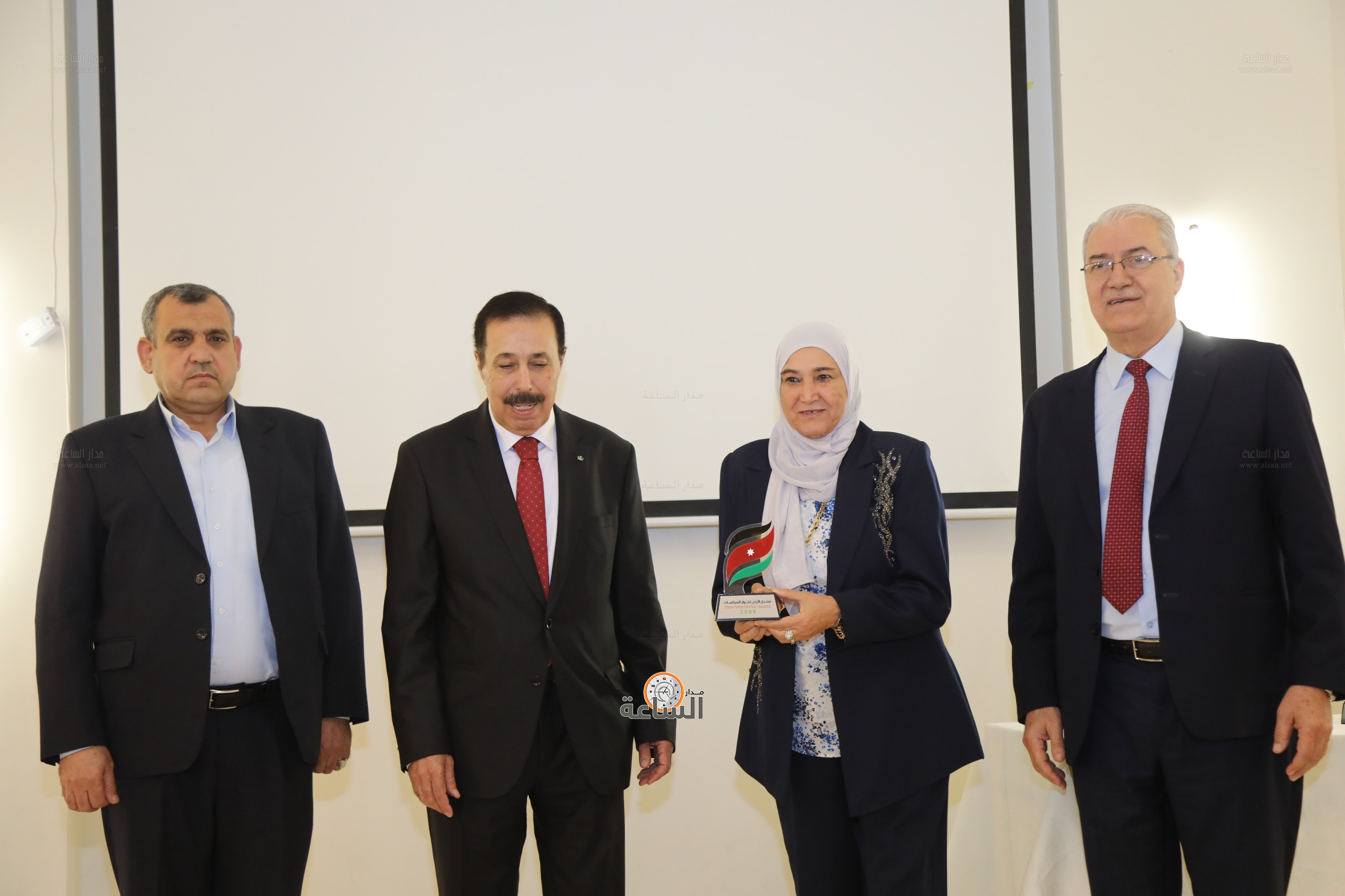 Madar Al-Saa Images 0.8212389399094729