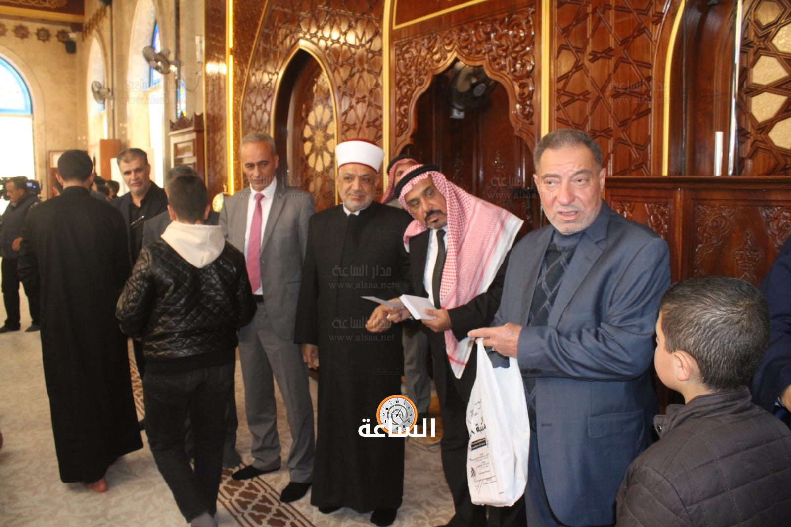 Madar Al-Saa Images 0.7189004641487016